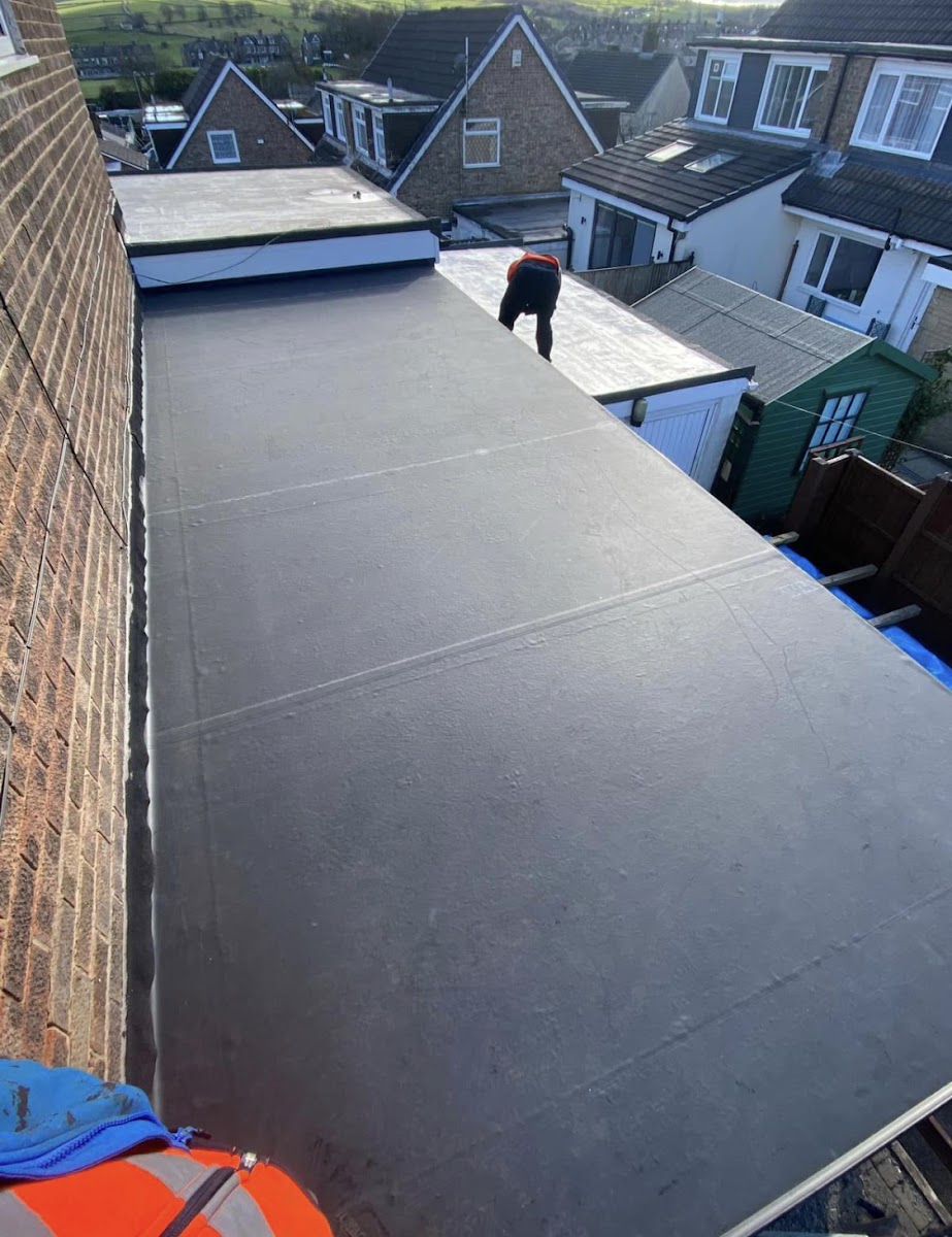 Flat roof completed, our team finishing up